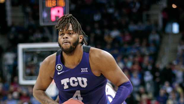 Mar 11, 2022; Kansas City, MO, USA; TCU Horned Frogs center Eddie Lampkin (4) looks to pass during the first half against the Kansas Jayhawks at T-Mobile Center. Mandatory Credit: William Purnell-USA TODAY Sports